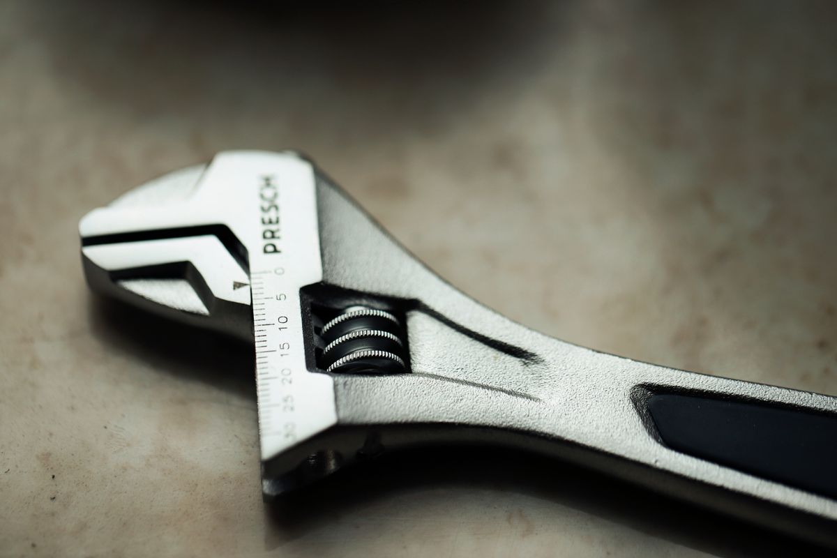 Close-up of an adjustable spanner and its movable jaw