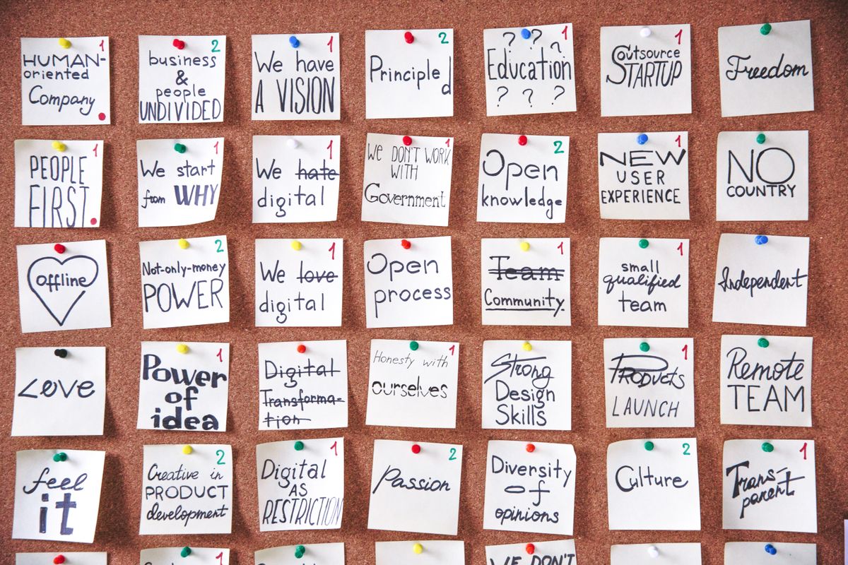 Notes pinned to a cork noticeboard