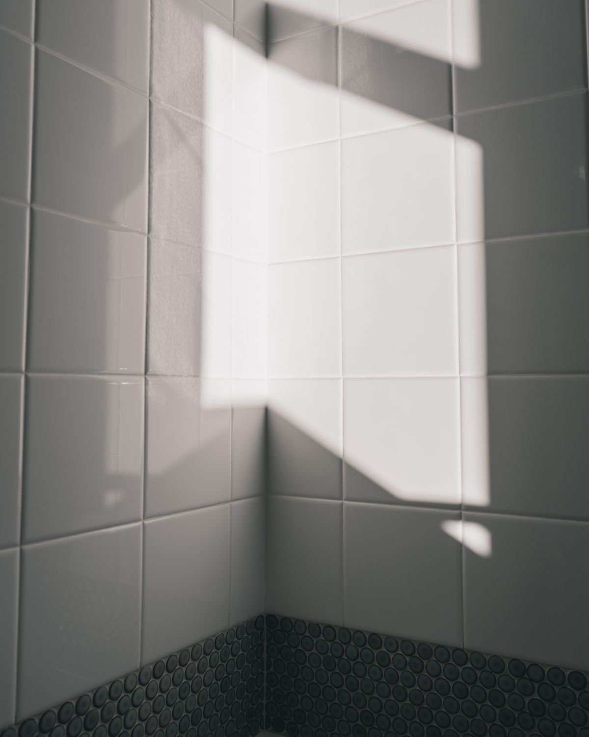 Ceramic bathroom tiles with visible grout lines