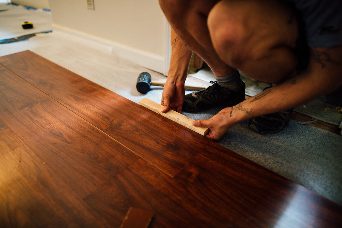 Laminate floor boards being fitted