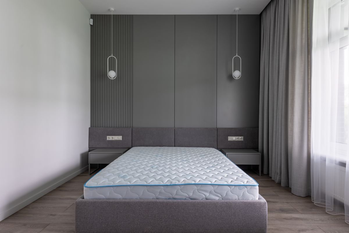 Bare mattress on a bed frame