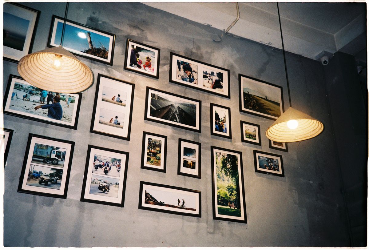 Picture frames arranged across a wall