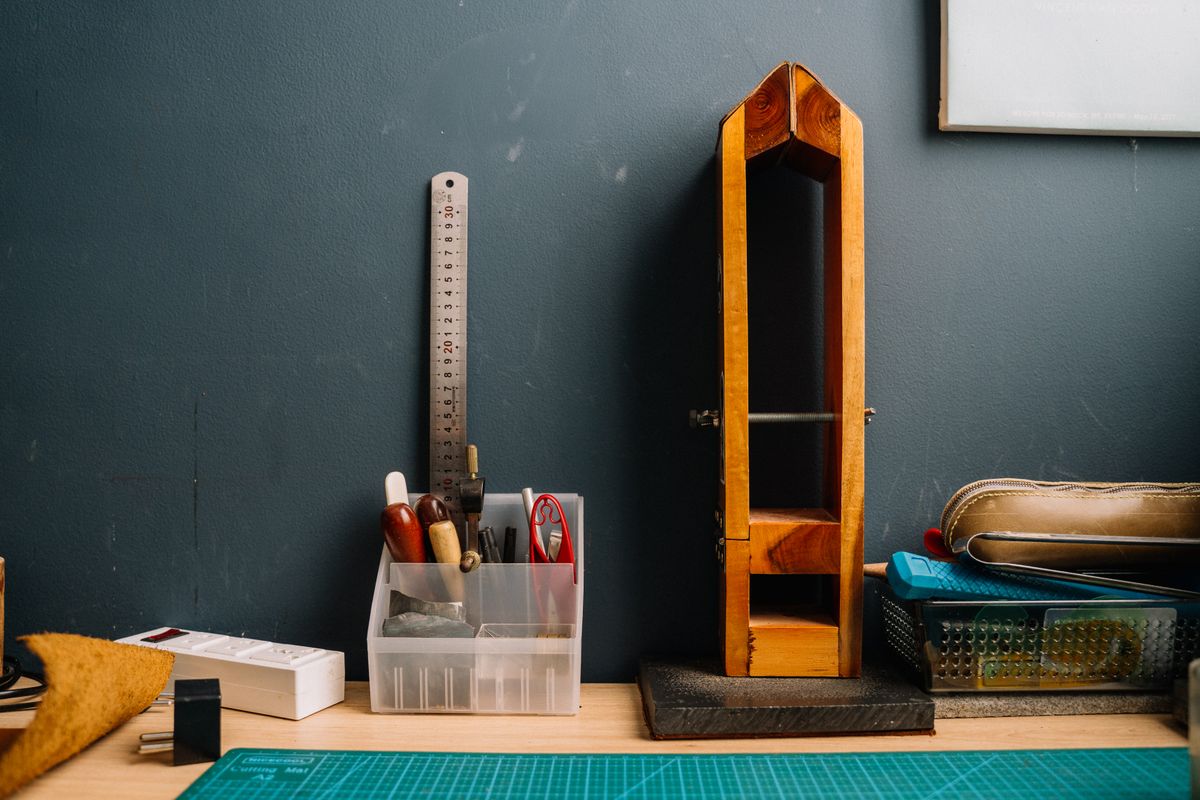 A protected work surface with neatly arranged hand tools